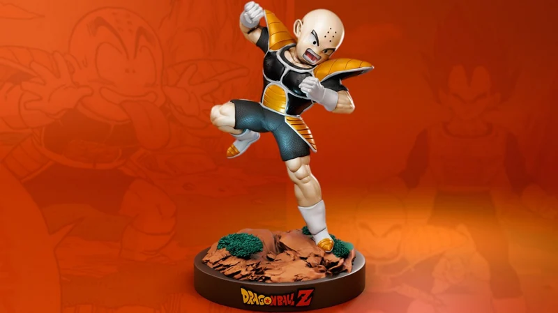 Krillin Dragon Ball Z figurine in a dynamic fighting pose on a rocky base