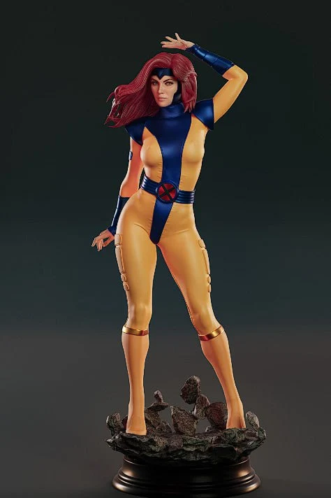 Jean Grey Marvel statue in a blue and gold X-Men suit on a rocky pedestal