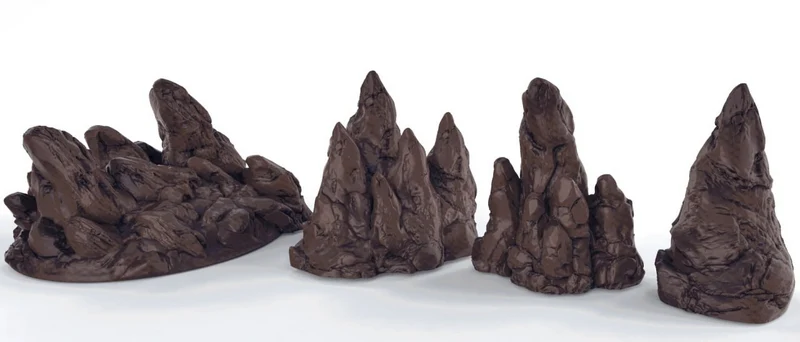 Four separate rocky terrain formations with pointed peaks and layered surface detail