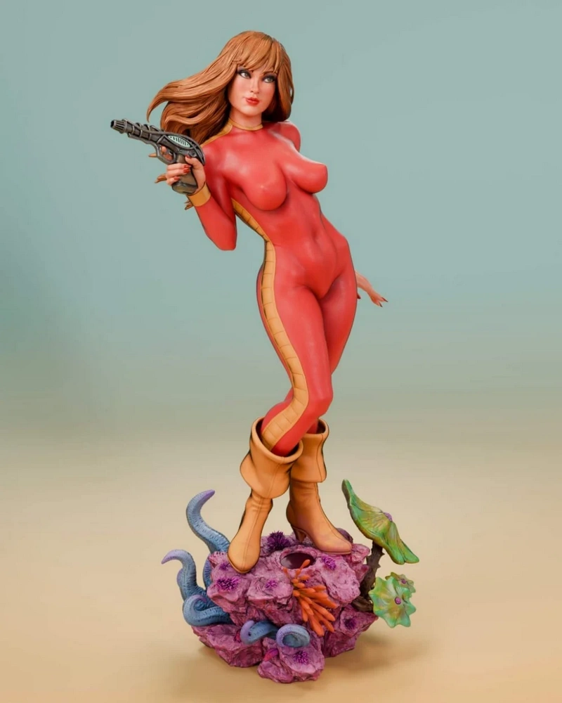 Barbarella figure in a red suit holding a ray gun on an alien-themed base
