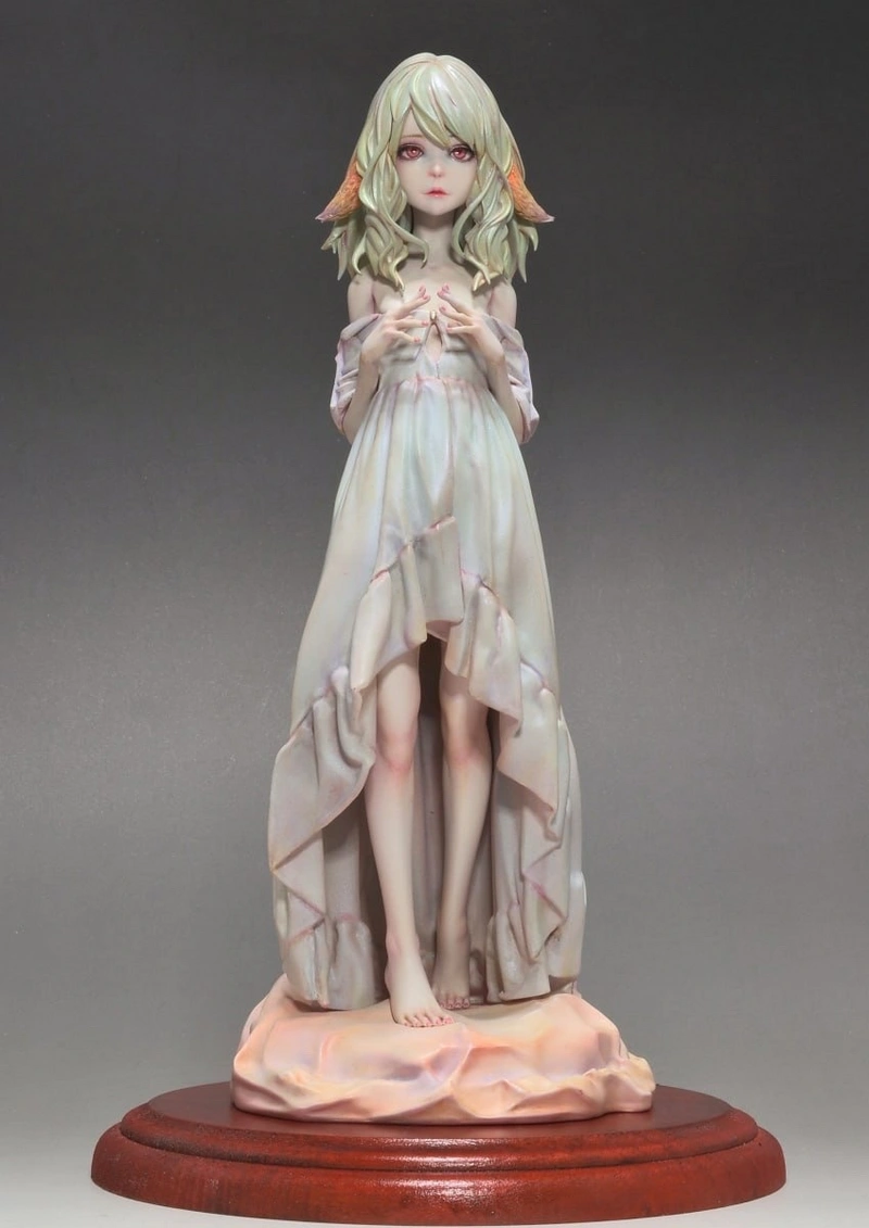 Actres fantasy character statue with flowing pale dress and sculpted base