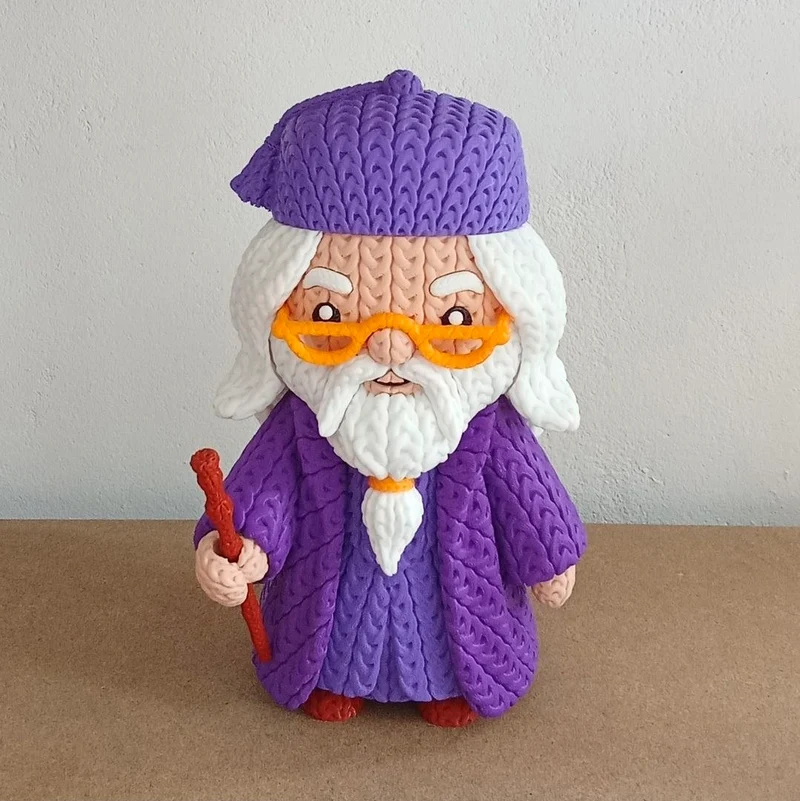 Stylized Alvo Dumbledore figure with purple robes, orange glasses, and a wand
