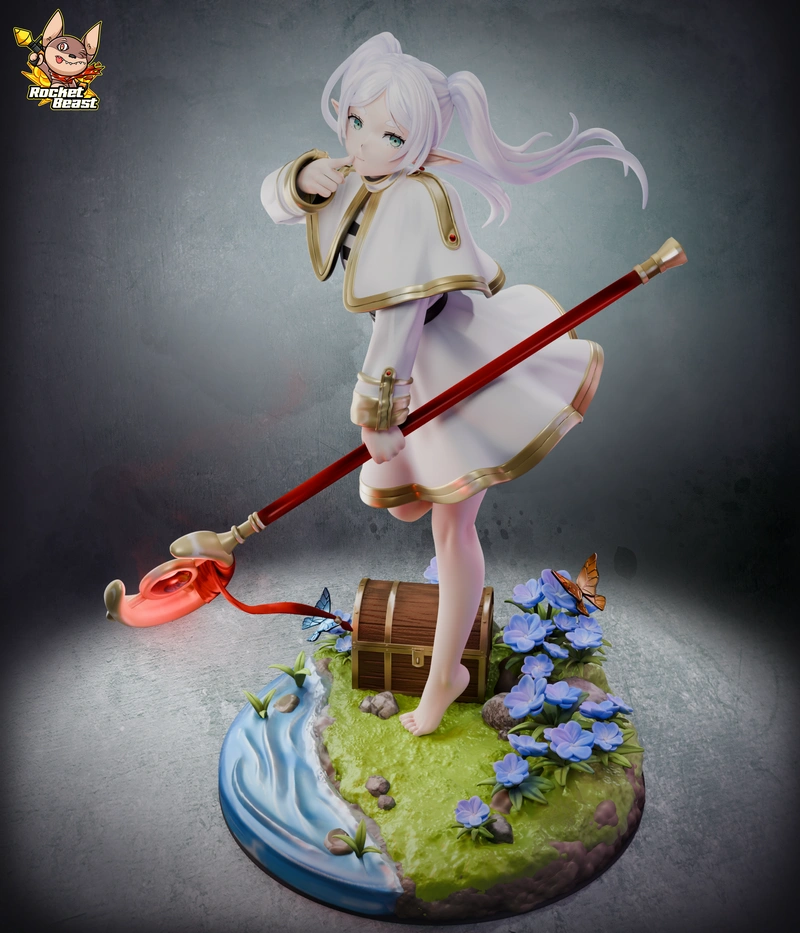 Frieren anime character figure with staff on a flower-filled scenic base