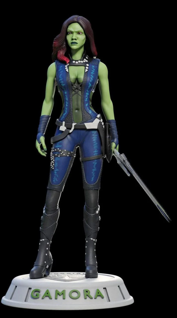 Gamora Marvel character statue with green skin, blue outfit, sword, and labeled display base