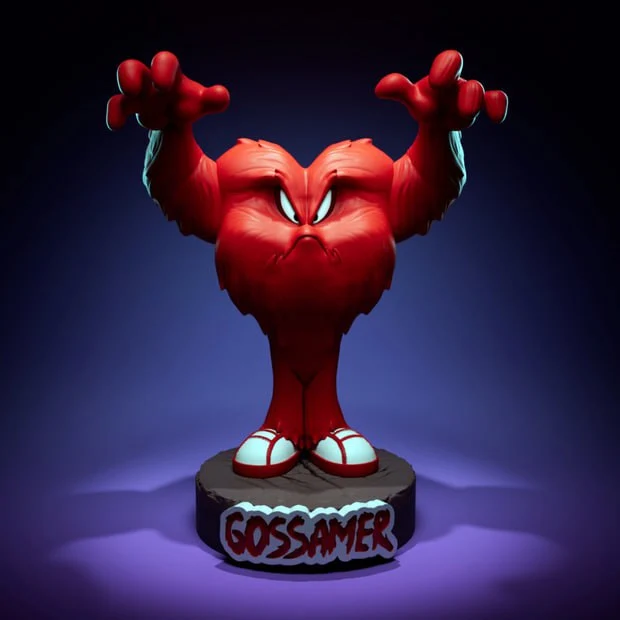Gossamer from Looney Tunes, red furry character with raised arms on a display base