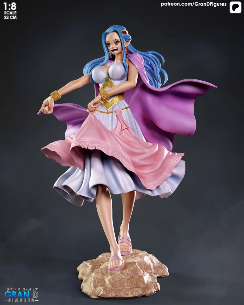 Standing blue-haired female character figure in a pink dress and purple cape on a rock base