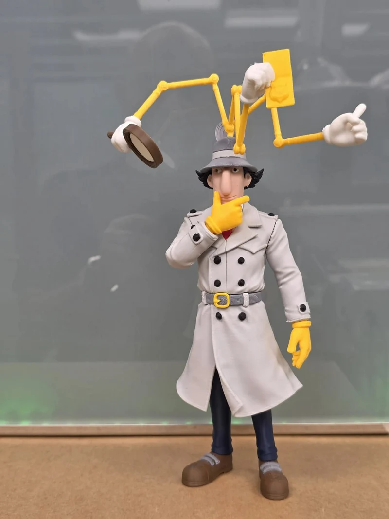 Inspector Gadget figure with trench coat, hat, and extended gadget arms