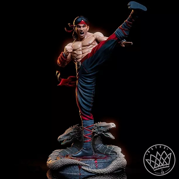 Liu Kang Mortal Kombat statue performing a high kick above a coiled dragon base