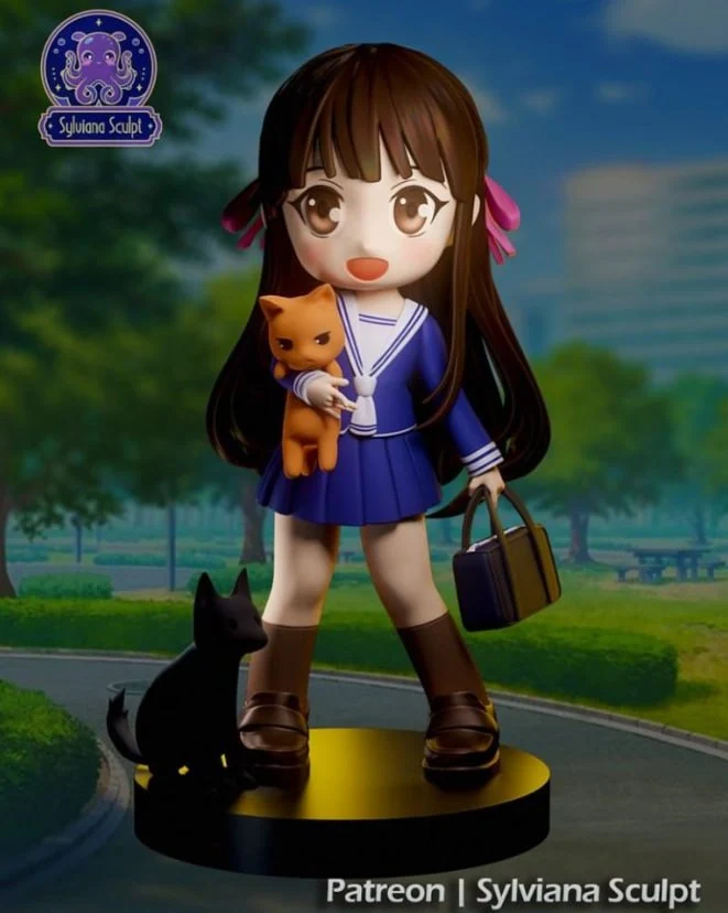 Chibi Tohru Honda figure in a sailor uniform holding a cat on a display base
