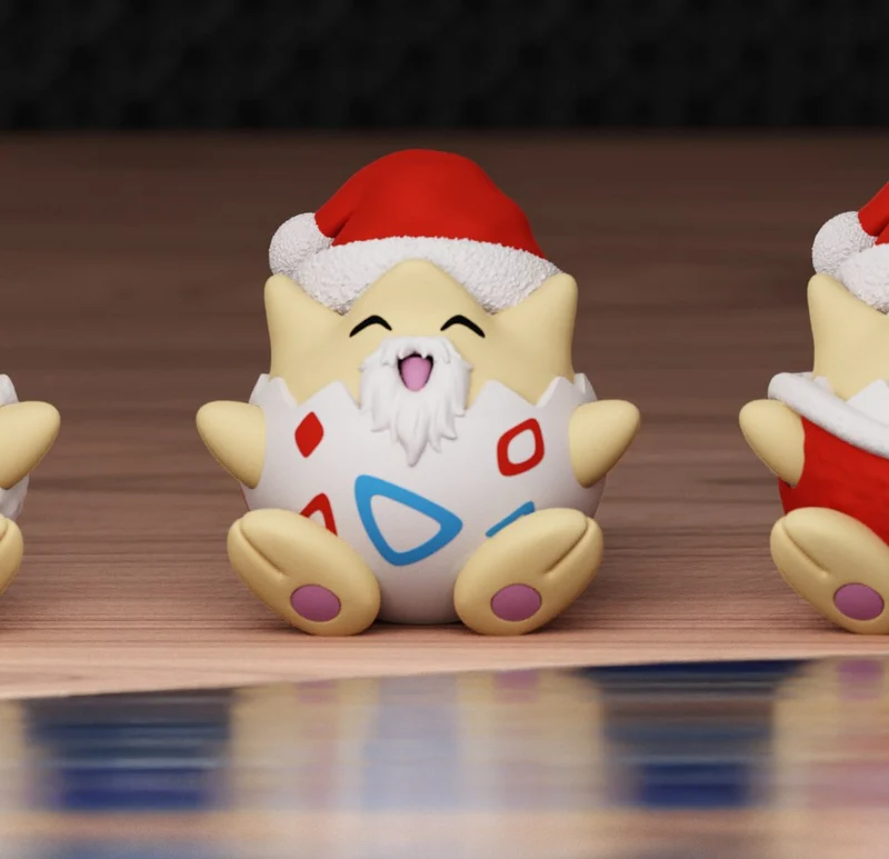Stylized seated Toge Inumaki figure wearing a Santa hat with a white beard and colorful torso markings