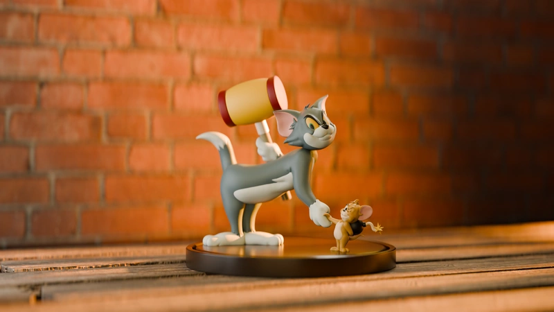 Tom and Jerry 3D model with Tom holding a mallet over Jerry on a round display base