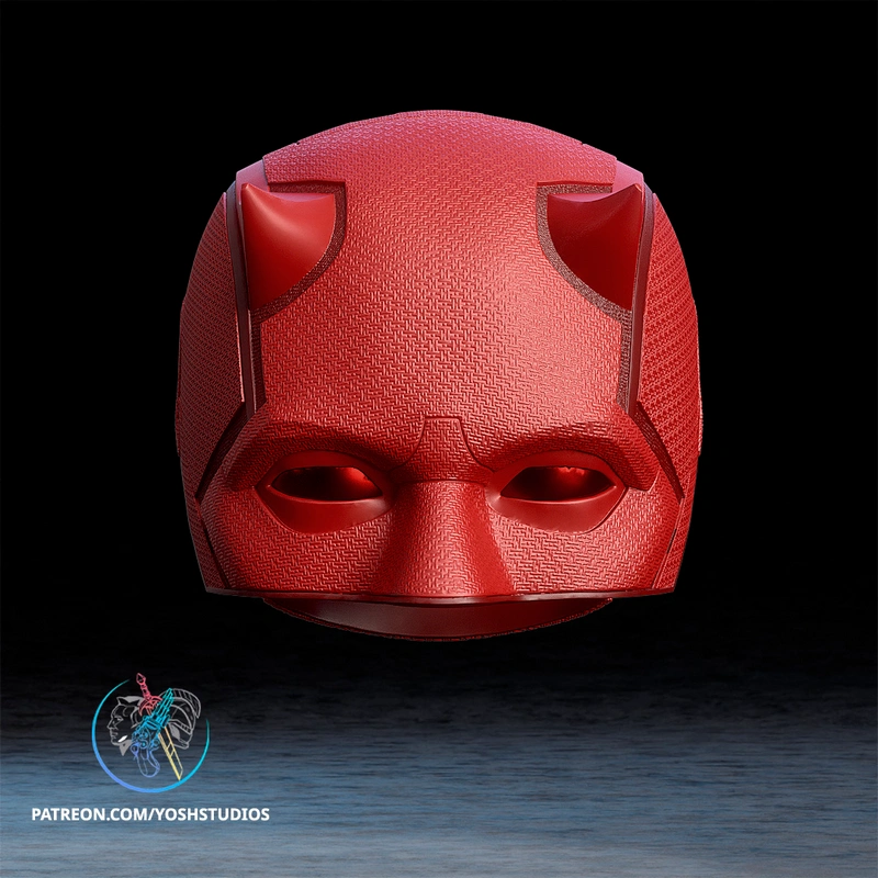 Red Daredevil Born Again helmet with textured panels and narrow eye openings