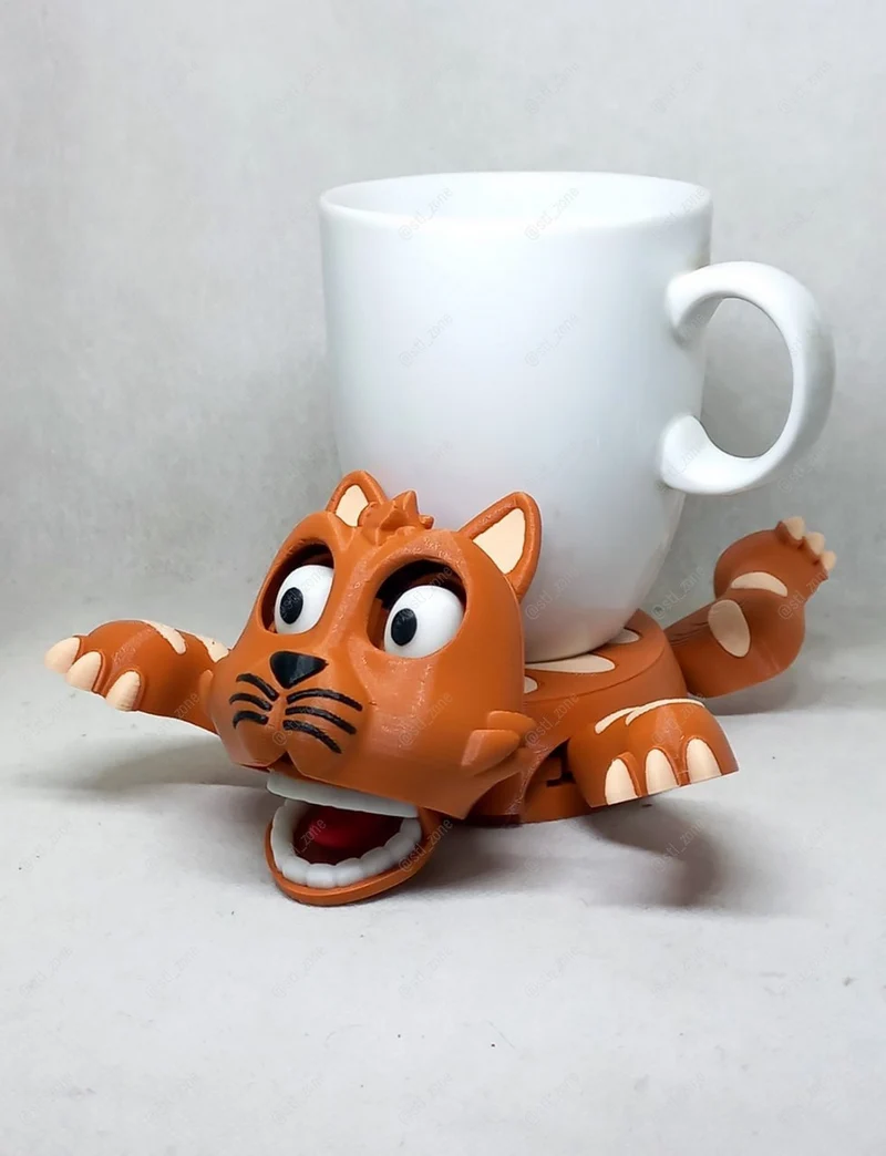 Orange cat-shaped cup holder with expressive eyes, paws, and curled tail