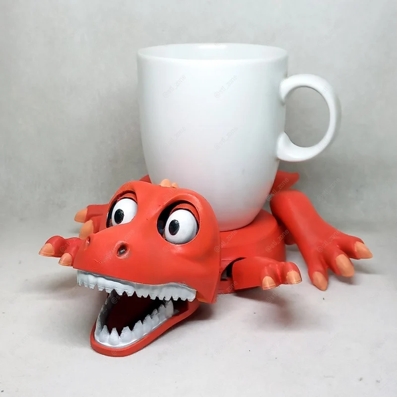 Red T-Rex cup holder with an open toothy mouth, claws, and a white mug on top