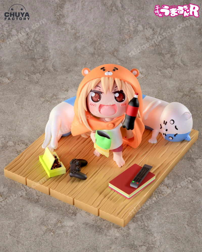 Chibi Umaru figure in an orange bear hood with a companion and display props