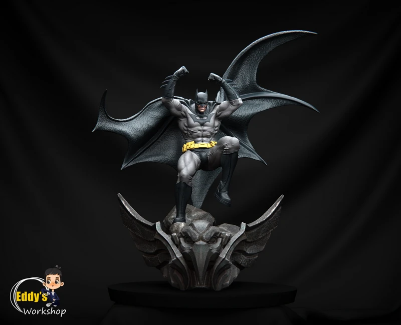 Batman statue with spread cape mounted above a winged gargoyle base