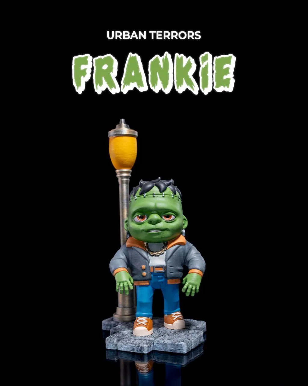 Frankie green monster statue with streetlamp, jacket, sneakers, and rocky base