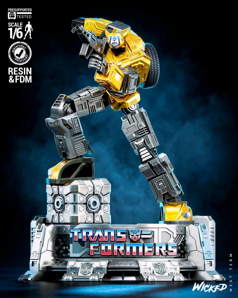 Yellow Bumblebee Transformers sculpture with weapon on a detailed display base