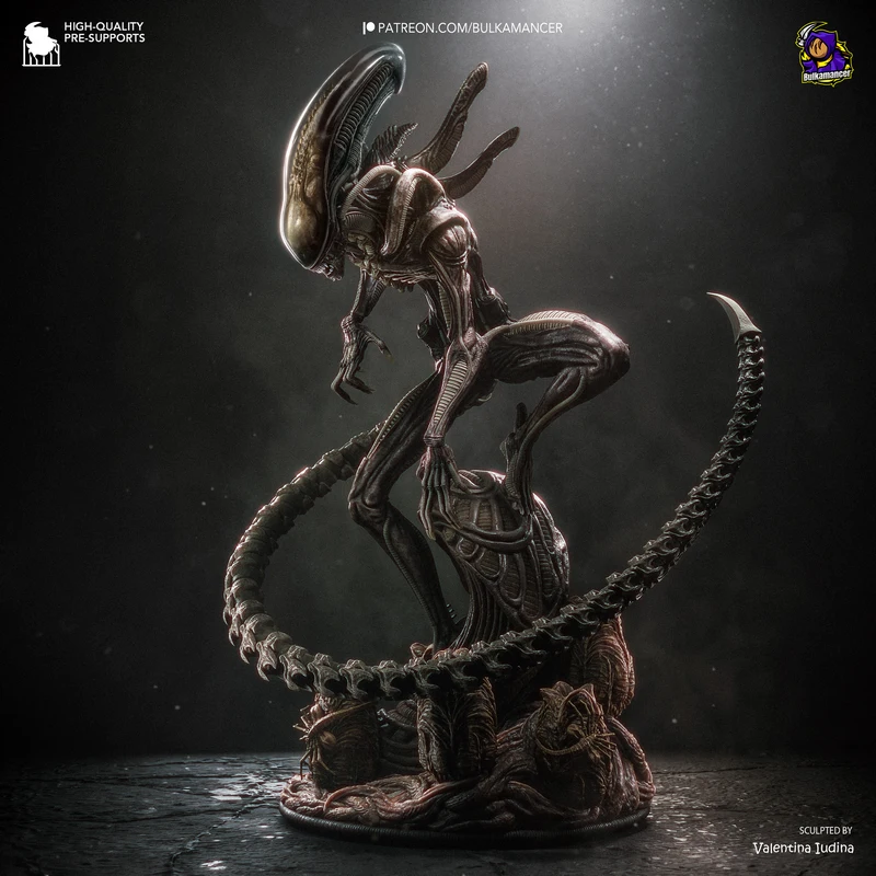 Crouching Xenomorph Alien figurine with domed head, curled tail, and sculpted base