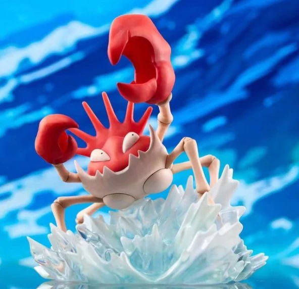 Kingler Pokémon figure with raised claws on a blue-white wave base