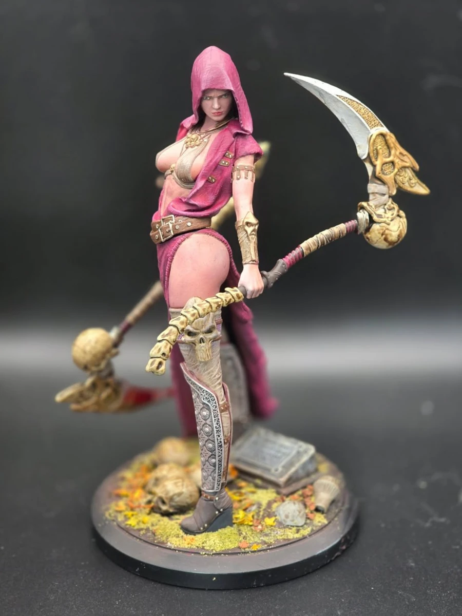 Mortaya fantasy warrior figure with pink hood, crescent polearm, and decorated display base