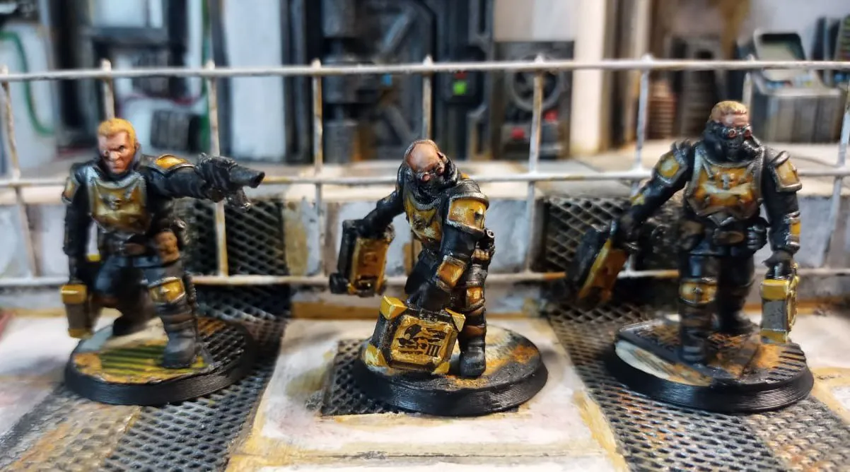 Three armored original sci-fi pilot miniatures on round bases